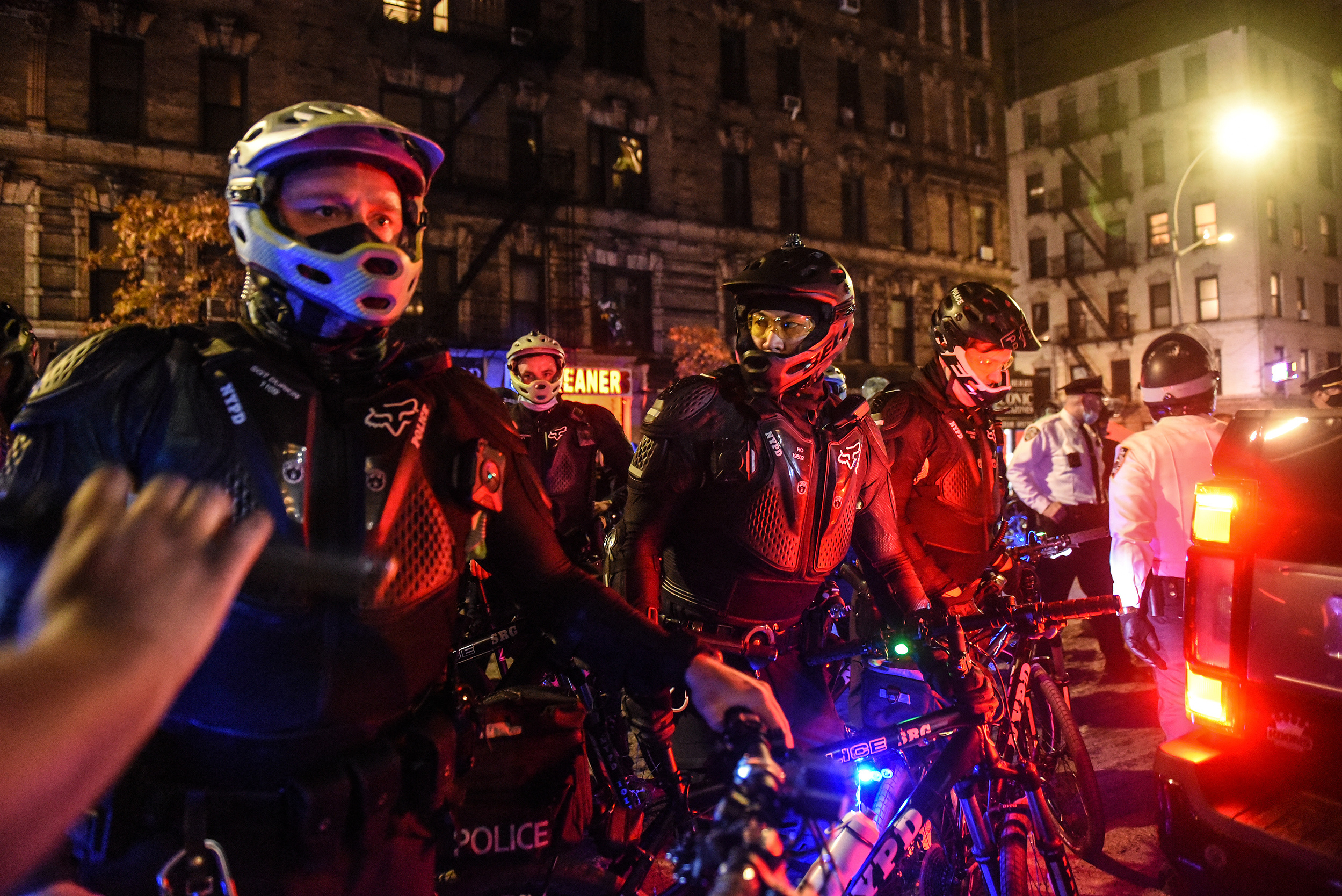 New York Police Department (NYPD) officers ride bicycles at a protest during the 2020 Presidential election in New York, U.S., on Thursday, Nov. 5, 2020. Joe Biden stood on the brink of claiming the presidency from Donald Trump on Thursday, with a handful